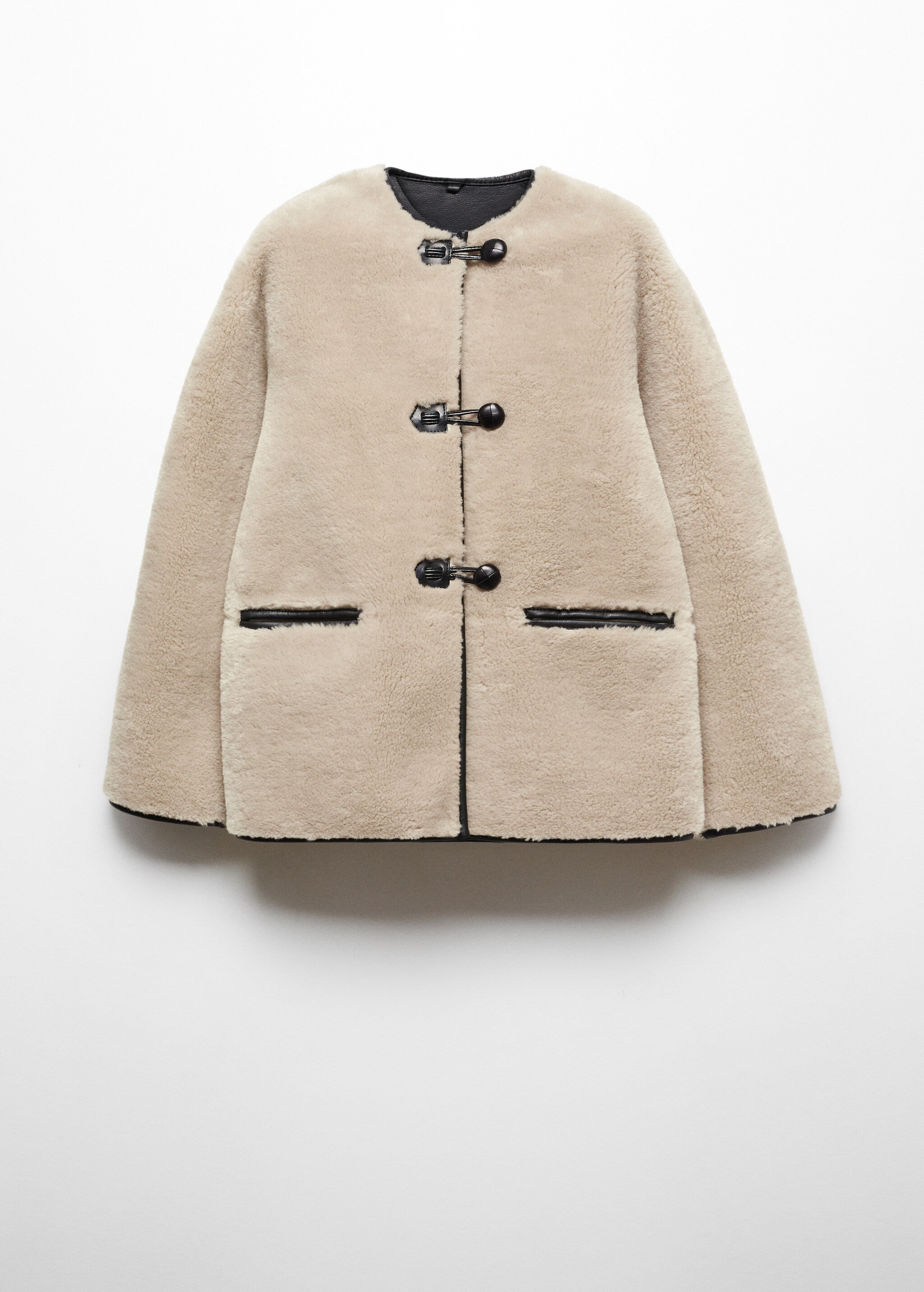 Faux fur coat with applications